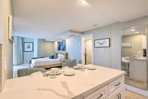 a room with a kitchen and a bedroom with a bed at Oceanfront Luxury Renovated Resort Getaway! in Fort Lauderdale