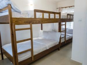 Μία ή περισσότερες κουκέτες σε δωμάτιο στο Mkomazi Hotels and Camps
