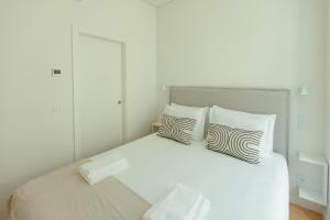 Postel nebo postele na pokoji v ubytování Trindade 19 Apartments - 1B Aragonês