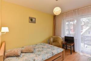 Postel nebo postele na pokoji v ubytování Vila Nendrė + 75 fotografií