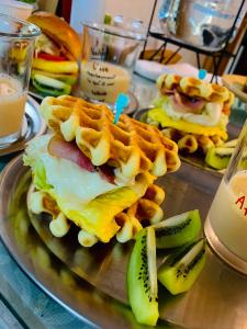 a plate with a waffle sandwich and waffles and waffleasyasyasy at Early Summer in Huxi