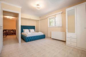 A bed or beds in a room at Villa with Private S Pool-Theologos by GHH