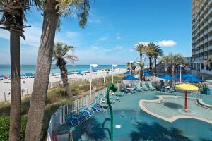 a resort with a swimming pool and a beach at Boardwalk 1502 in Panama City Beach