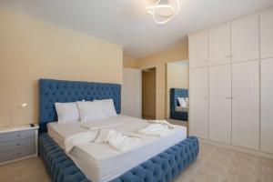 A bed or beds in a room at Villa with Private S Pool-Theologos by GHH