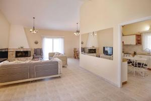 A kitchen or kitchenette at Villa with Private S Pool-Theologos by GHH