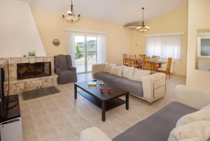 A seating area at Villa with Private S Pool-Theologos by GHH