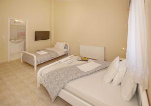 A bed or beds in a room at Villa with Private S Pool-Theologos by GHH