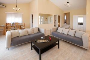 A seating area at Villa with Private S Pool-Theologos by GHH
