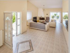 A seating area at Villa with Private S Pool-Theologos by GHH