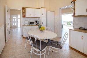 A kitchen or kitchenette at Villa with Private S Pool-Theologos by GHH
