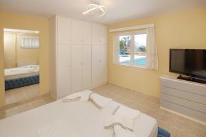 A bed or beds in a room at Villa with Private S Pool-Theologos by GHH
