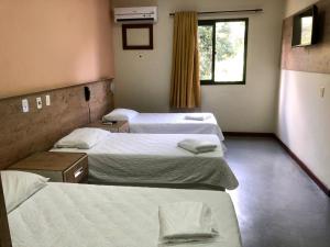 Postel nebo postele na pokoji v ubytování Hotel Rinkao