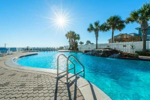 a swimming pool with a stairway leading into a resort at Majestic Beach Towers 2-603 in Panama City Beach