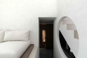 Cama ou camas em um quarto em CUBIC Mykonos Seafront Design Suites