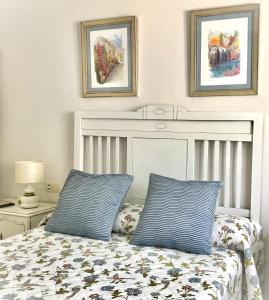 Łóżko lub łóżka w pokoju w obiekcie Apartamento Las Flores