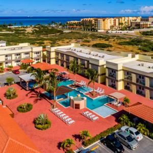 an aerial view of a resort with a swimming pool at Family Apartment with Pool in Aruba in Palm-Eagle Beach