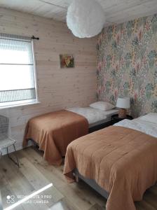 Postel nebo postele na pokoji v ubytování Morska Szyszka & Leśne SPA