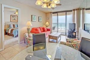 a living room with a couch and a bed at Nautilus 1303 in Fort Walton Beach