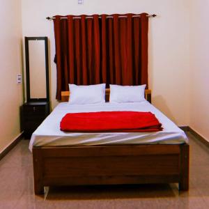 เตียงในห้องที่ Mungaru Homestay, Talaguppa