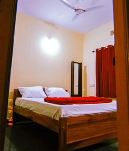 เตียงในห้องที่ Mungaru Homestay, Talaguppa