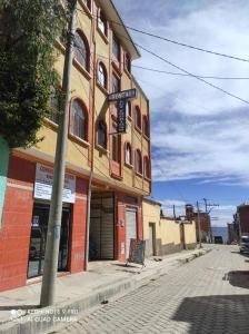 a building on the side of a street at HOSTAL Luz YHOBIMAR in Copacabana