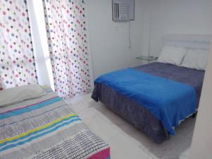 Postel nebo postele na pokoji v ubytování Apto na cobertura a 190 m do mar no Rio de Janeiro