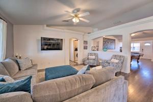 a living room with two couches and a ceiling fan at Lake Havasu Home with EV Charger Near Launch Ramp! in Lake Havasu City