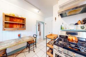 a kitchen with a stove and a counter top at Casita Testoro in Santa Fe