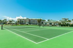 a tennis court in front of a apartment complex at Maravilla 3202 in Destin