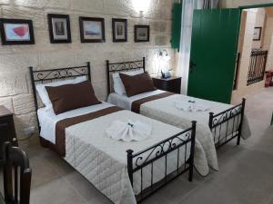 The Hidden Gem Boutique Hotelにあるベッド