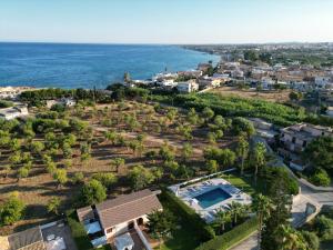 an aerial view of a resort with the ocean at Villa Dolmen Beach in Avola