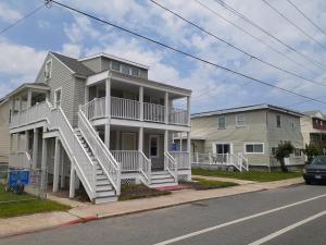 a house with stairs on the side of a street at Bill's Apartments in Ocean City
