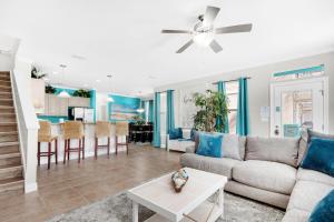 a living room with a couch and a table at Turquoise Waters in Destin