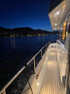 a deck of a boat in the water at night at Yacht San Lorenzo 22 in La Spezia