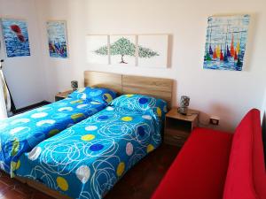 A bed or beds in a room at Casa Alessandria