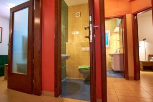 a bathroom with a toilet and a sink at Pansion HRGA in Vodice +102 photos