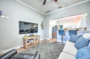 a living room with a couch and a table at Updated Ybor City Duplex about half Mi to Seventh Ave! in Tampa