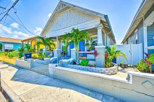 a house with palm trees in the front yard at Updated Ybor City Duplex about half Mi to Seventh Ave! in Tampa