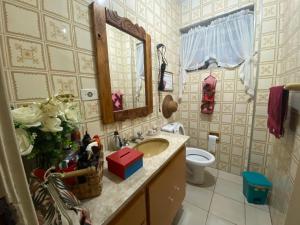a bathroom with a sink and a toilet at Pousada Family Consulado Americano in São Paulo +29 photos