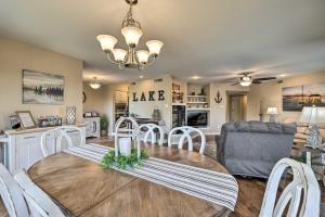 a dining room and living room with a table and chairs at Beautiful Hot Springs Condo with Lake Hamilton Views in Hot Springs