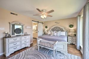 a bedroom with a bed and a ceiling fan at Beautiful Hot Springs Condo with Lake Hamilton Views in Hot Springs +28 photos