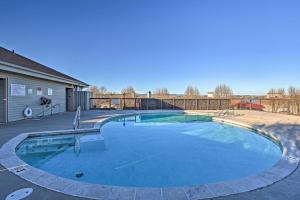 a large swimming pool in a yard with a house at Beautiful Hot Springs Condo with Lake Hamilton Views in Hot Springs