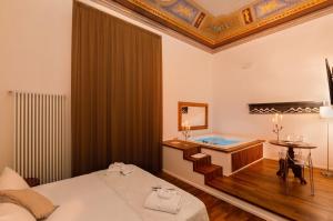 A bed or beds in a room at Naca Suite