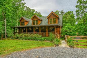 a wooden house with a fence in front of it at The Last Cast in Bumpass