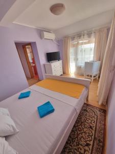 Katil atau katil-katil dalam bilik di Villa Camelia