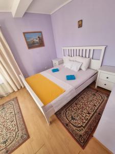 Katil atau katil-katil dalam bilik di Villa Camelia