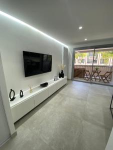Televízia a/alebo spoločenská miestnosť v ubytovaní Cannes - Magnifique studio moderne