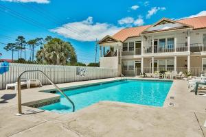 The swimming pool at or near Poinciana Place #123