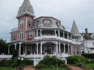 
a large brick building with a clock on the front of it at Angel of the Sea Bed and Breakfast in Cape May
