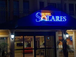 a hotel saales sign on a building at night at Hotel Solares in Santa Cruz +59 photos